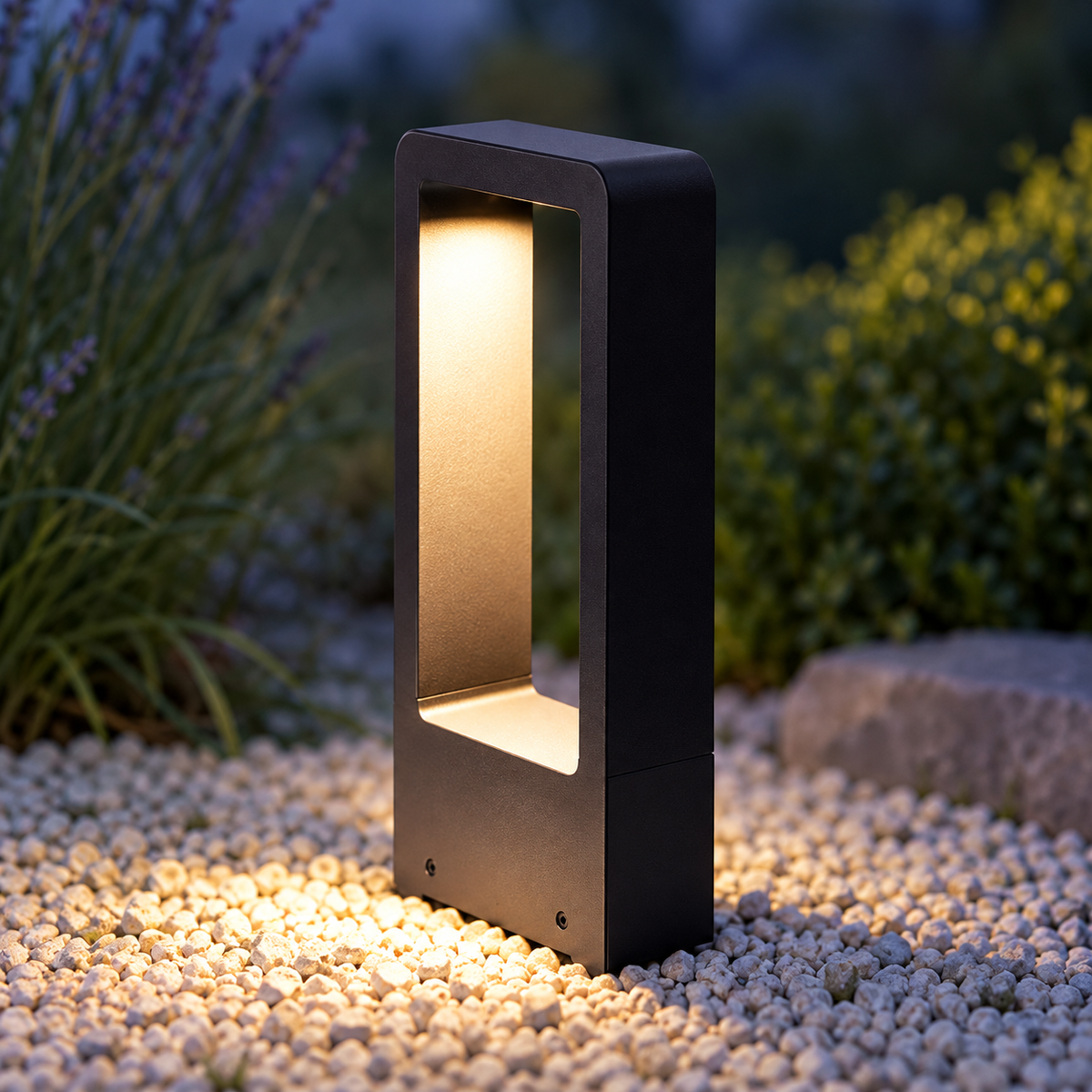 Black LED garden bollard light illuminating a path – primary shopping image