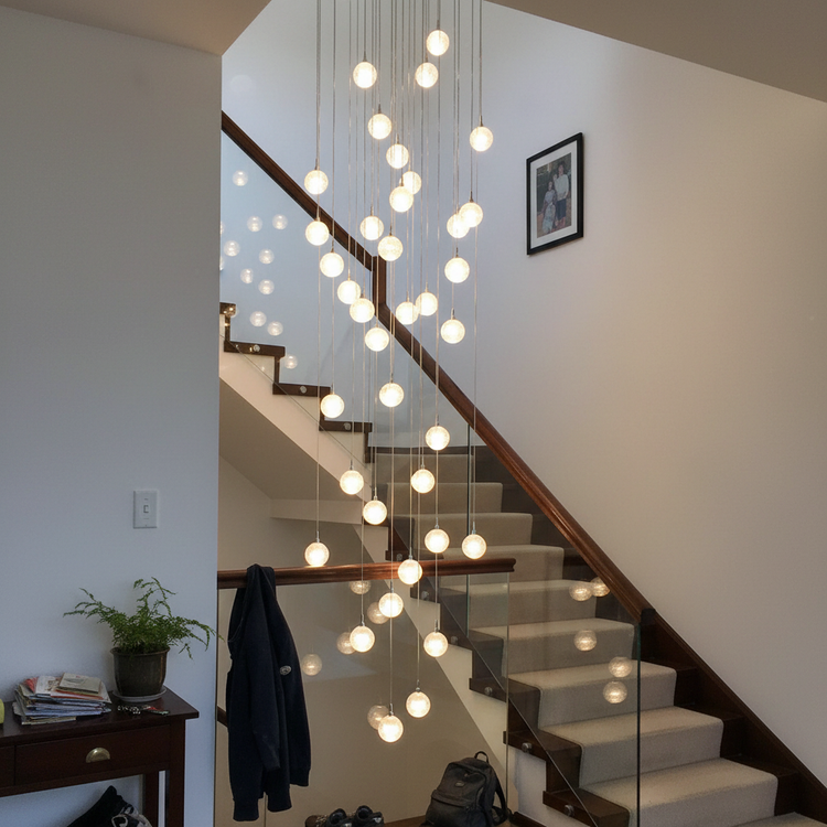 Customer photo of cascading chandelier in stairwell